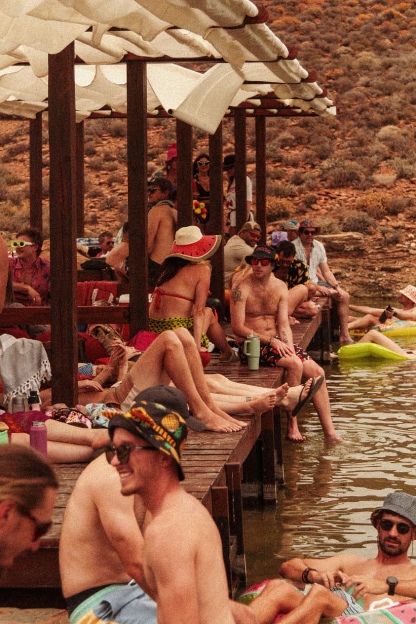Festivalgoers relaxing by the water at Infinity Dam