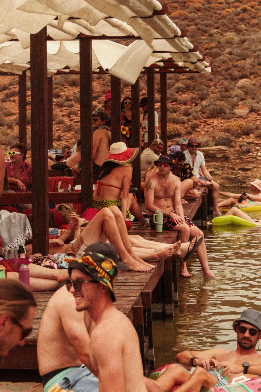 Festivalgoers relaxing by the water at Infinity Dam