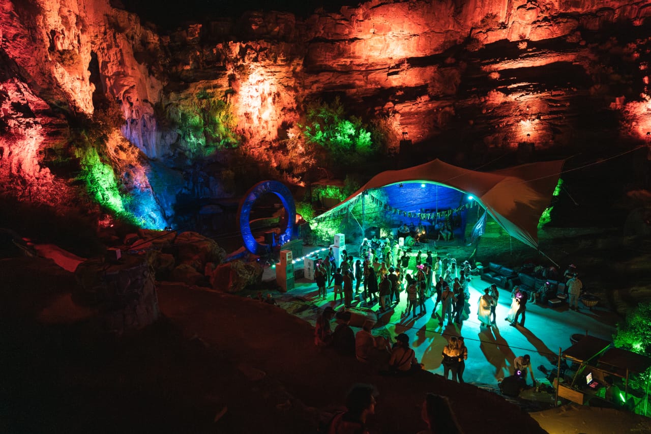 Night party in the canyon with colorful lighting